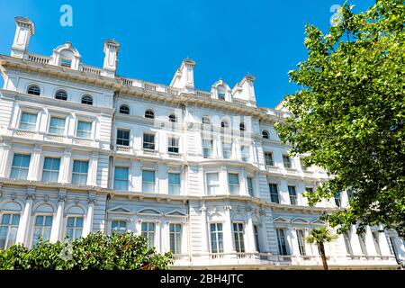 London, UK view of neighborhood district of Kensington by Lancaster high street upscale white luxury Hyde Park Hotel architecture and nobody with blue Stock Photo