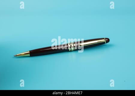 A ball pen on Blue background. Stock Photo