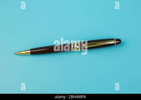 A ball pen on Blue background. Stock Photo