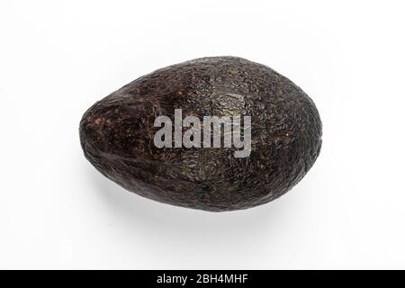 Ripe avocado isolated on blue background Stock Photo