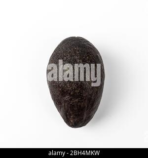 Ripe avocado isolated on blue background Stock Photo