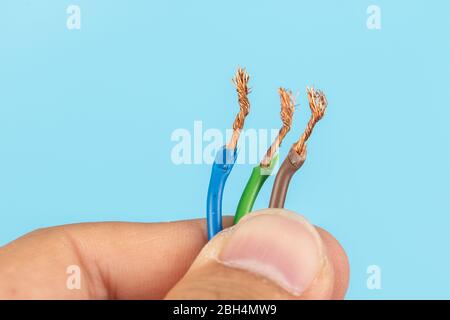 Electric wire isolate on blue background Stock Photo