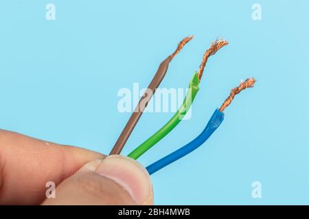 Electric wire isolate on blue background Stock Photo