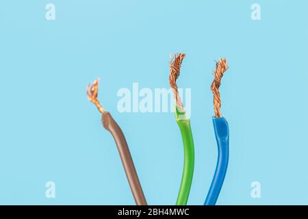 Electric wire isolate on blue background Stock Photo