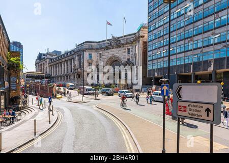 London, UK - June 22, 2018: High angle view road street by underground Waterloo station with sign and traffic and historic architecture on sunny day Stock Photo