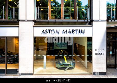 London, UK - June 22, 2018: Park lane street in downtown Mayfair with Stratstone Aston Martin store shop and sign with Brook house Stock Photo