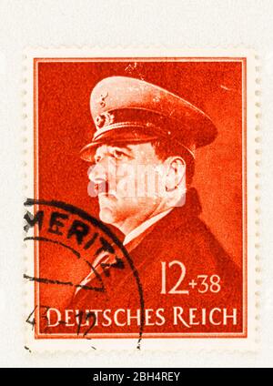 SEATTLE WASHINGTON - April 22, 2020: 1941 German Reich postage featuring dictator Adolf Hitler on stamp with surcharge, commemorative of 52 birthday. Stock Photo