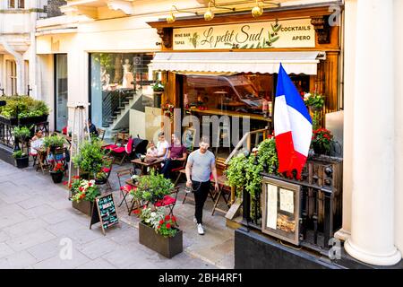 London, UK - June 22, 2018: Neighborhood district of Kensington with Le Petit Sud restaurant cafe shop sign during summer day above view with french f Stock Photo