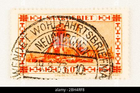 SEATTLE WASHINGTON - April 22, 2020:  1930 Stamp of Saargebiet featuring mining collier shaft head with  large dark 1933 Neunkirchen postmark. Scott # Stock Photo