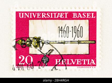 SEATTLE WASHINGTON - April 18, 2020:  Swiss postage stamp 500 anniversary of University of Basel, featuring Founding Charter and Scepter. Scott 379 Stock Photo