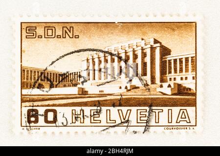 SEATTLE WASHINGTON - April 18, 2020: 1938 Swiss postage stamp with main building of the Palace of Nations, celebrating the opening of the Assembly Hal Stock Photo