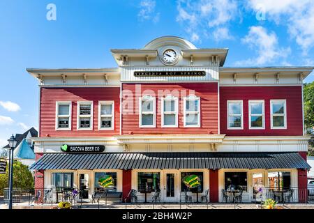 Hot Springs, USA - October 18, 2019: Historic downtown town village city in Virginia countryside with sign clock time on building street Stock Photo