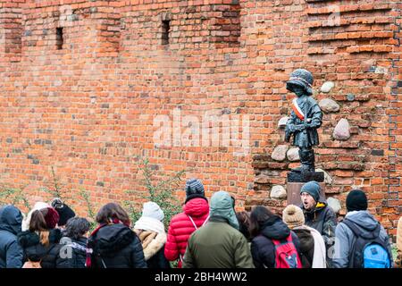 Warsaw, Poland - December 25, 2019: Monument or sculpture statue of little insurrectionist, a child hero fighting in Warszawa Uprising of 1944 with gr Stock Photo