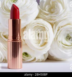Red lipstick and white roses Stock Photo