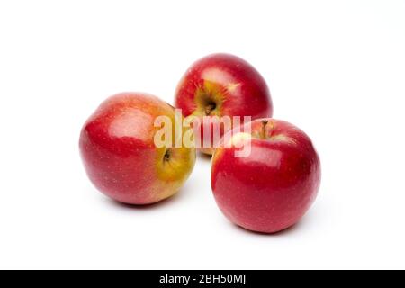 Three ripe red apples isolated on a white background. Stock Photo