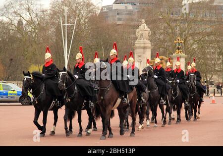 Members of the Household Cavalry participate in the Changing of the Guard at Buckingham Palace in London, England March 13, 2020 in London, England Stock Photo