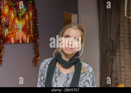 Indoor portrait of a woman with a scarf Stock Photo