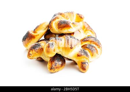 Sweet homemade croissants with poppy isolated on white background. Stock Photo