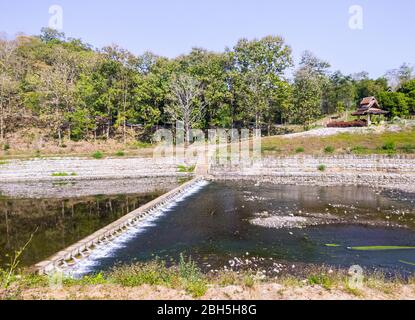 Small irrigation dam for water slowing after flowing from the large dam, distributed to the cultivated area in the country of Thailand. Stock Photo