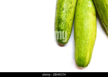 Three cucumbers on an isolated white backgrounds Stock Photo
