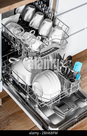 Clean dishes washed to a shine in the dishwasher. Always clean dishes in the kitchen Stock Photo