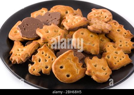 Halloween cookies on black plate isolated on white background Stock Photo