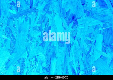 Textured compressed wooden panel blue tone detail. Recycled material. Timber Stock Photo