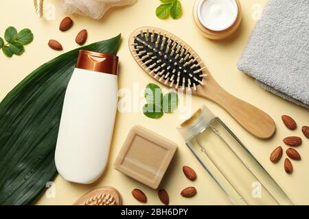 Composition of personal hygiene with bottles of cosmetics on beige background Stock Photo