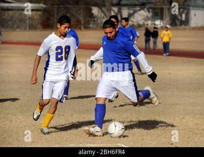 Austin, Texas USA, December 13, 2008: Soccer matchup between teams from Martin Middle School (white) against Webb Middle School (blue). The majority of players are Hispanic-American boys in seventh and eighth grade.  ©Bob Daemmrich Stock Photo