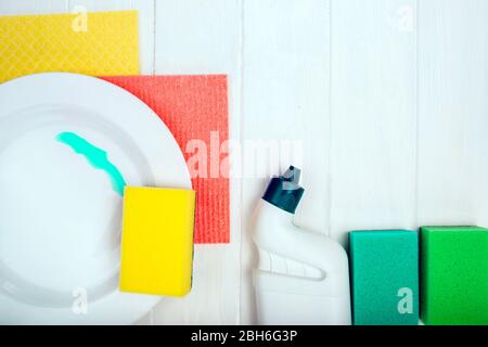 washing dishes and cleaning detergent on wooden table, top view Stock Photo