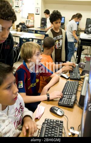 Austin, Texas USA, May 28, 2009: Sixth grade students sit at a bank of computers in a classroom at Kealing Middle School.  ©Bob Daemmrich Stock Photo