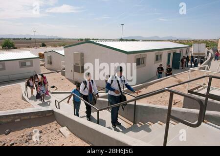 El Paso, Texas  May 28, 2009: Students walk up steps from portable classrooms to the main campus at Mission Early College High School in the Socorro school district of El Paso. Motivated students at the majority Hispanic school can earn an associate degree at El Paso Community College while studying for their high school diploma in the program.  ©Bob Daemmrich Stock Photo