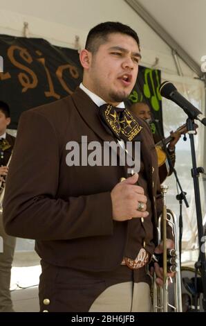 Austin Texas USA, 2009: Young musician sings into microphone during performance of traditional Mexican mariachi band. ©Marjorie Kamys Cotera/Daemmrich Photography Stock Photo