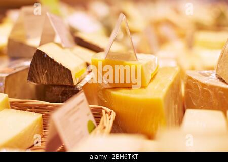 Packaged cheese in the cheese counter of a supermarket Stock Photo