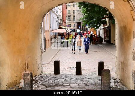 RIGA. LATVIA - AUGUST 28, 2018: The view through the Swedish gate in the old city Stock Photo