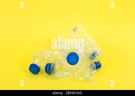 transparent plastic bottles with blue caps. Recycling concept Stock Photo