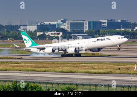 Guangzhou, China – September 25, 2019: Mahan Air Airbus A340-600 airplane at Guangzhou airport (CAN) in China. Stock Photo