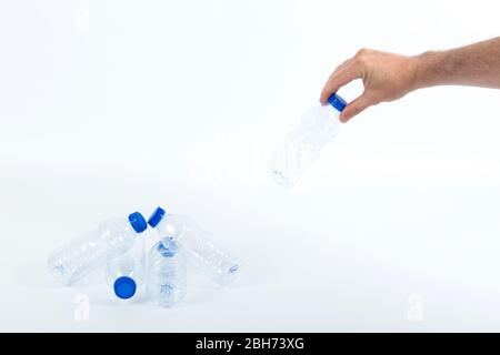 one hand recycling plastic bottles Stock Photo