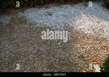 Brown and White pebble stone texture for background. The texture of brown gravel stones. Stock Photo