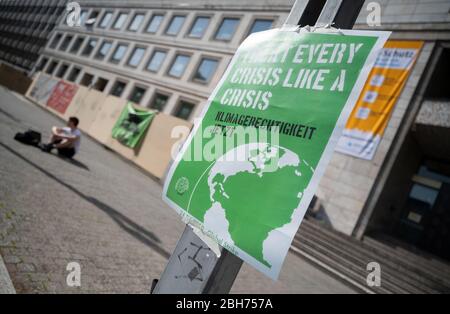 Stuttgart, Germany. 24th Apr, 2020. A poster hangs in front of the town hall during a campaign of the climate movement 'Fridays for Future'. Nationwide and also in Baden-Württemberg, the organization called for painted posters to be put up on windows and in the cities, thus continuing the protest while observing contact restrictions. Credit: Marijan Murat/dpa/Alamy Live News Stock Photo