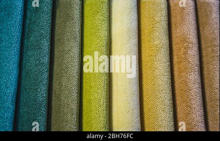 Close-up of different colored swatch fabric samples in a vertical pattern Stock Photo