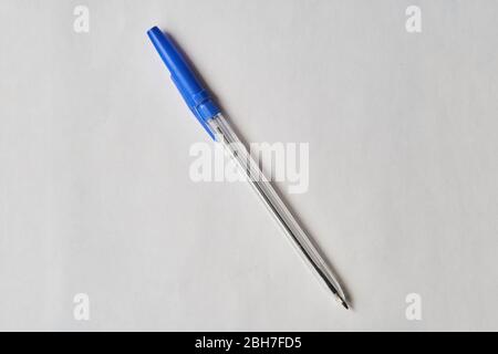 Blue plastic pen on a white background.  Stock Photo