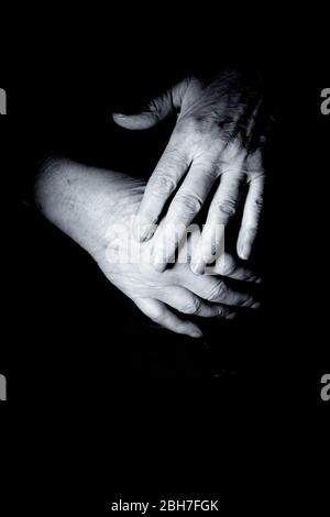 Hands of elderly woman doing a selfmassage. Manual physiotherapy Stock Photo