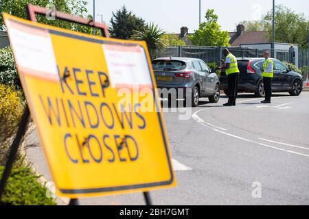 NOTE:NUMBER PLATE PIXELATED BY THE PA PICTURE DESK Staff direct cars at a drive through coronavirus testing site at a branch of Ikea, in Wembley, north London. Stock Photo