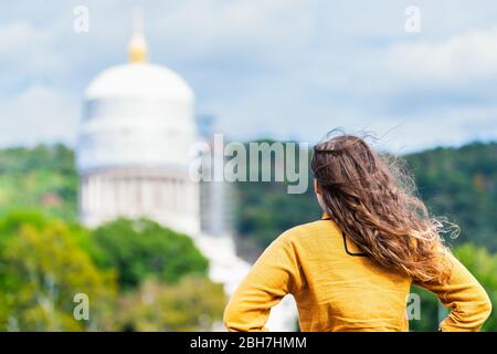 Charleston, West Virginia capital city with back of woman looking at scaffold construction on state capitol dome Stock Photo