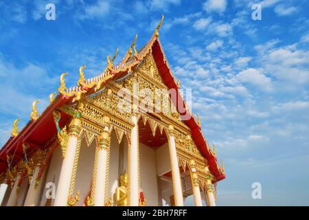 Photo of Wat Khao Noi; Beautiful temple with golden pattern decorating with blue sky as background July 20,2017 Pranburi, Thailand Stock Photo