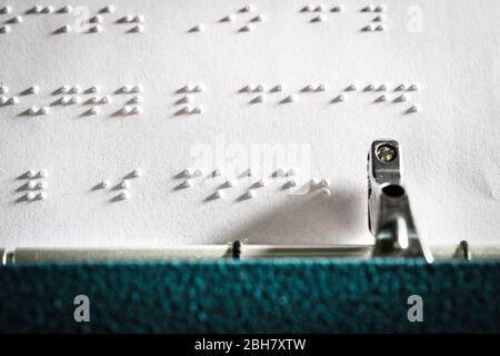 Braille being printed using a brailler typewriter Stock Photo