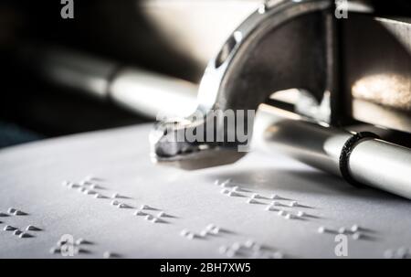Braille being printed using a brailler typewriter