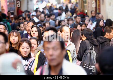 07.12.2019, Macao, , China - Crowd of people in the city centre. 00S191207D217CAROEX.JPG [MODEL RELEASE: NO, PROPERTY RELEASE: NO (c) caro images / So Stock Photo