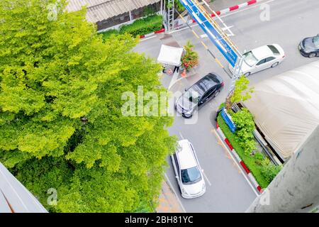 Photo of Three cars are turning left at the corner of the street beside The Mall department store Bangkapi, Thailand March 14, 2017 Stock Photo